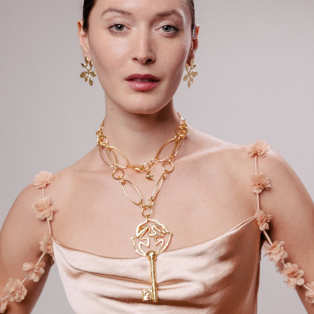 Pendentif doré Clé