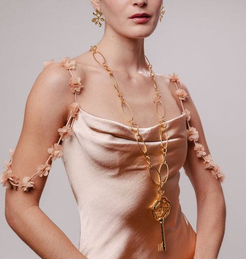 Pendentif doré Clé