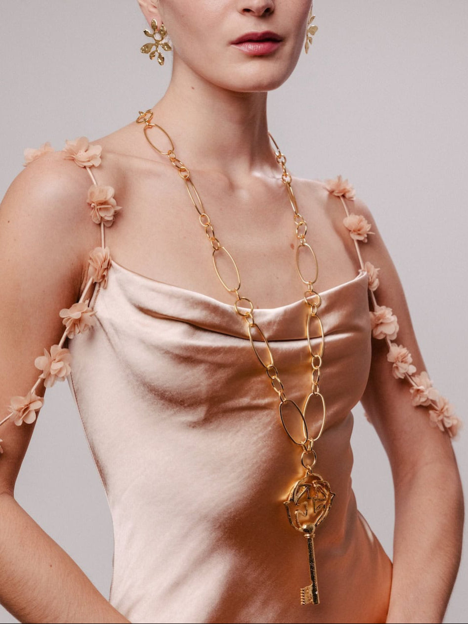 Pendentif doré Clé