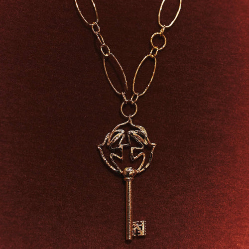 Pendentif doré Clé