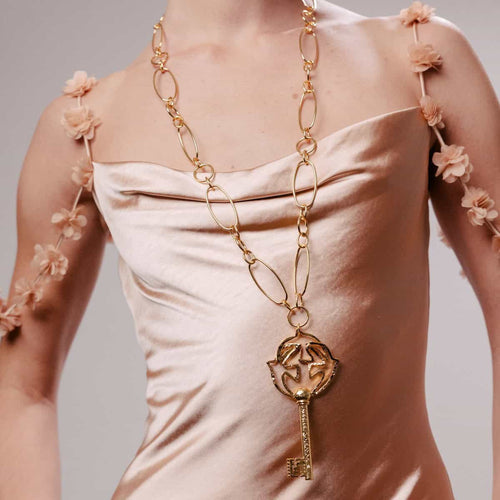 Pendentif doré Clé